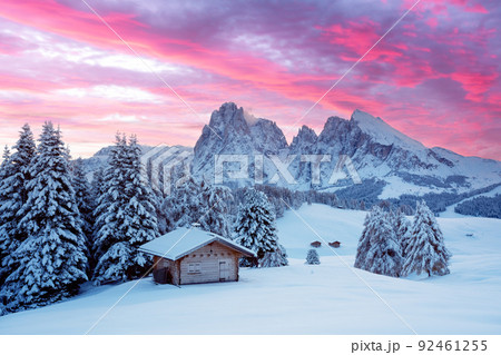 Picturesque landscape with small wooden house on meadow Alpe di Siusi Picturesque landscape with small wooden house on meadow Alpe di Siusi 92461255