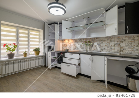 Renovated Interior for modern trendy white kitchen with doors open Renovated Interior for modern trendy white kitchen with doors open 92461729