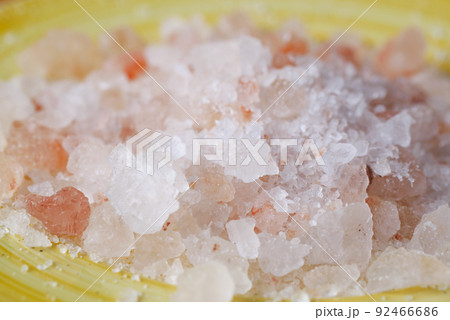 close up of pink rock salt in a bowl on table close up of pink rock salt in a bowl on table 92466686