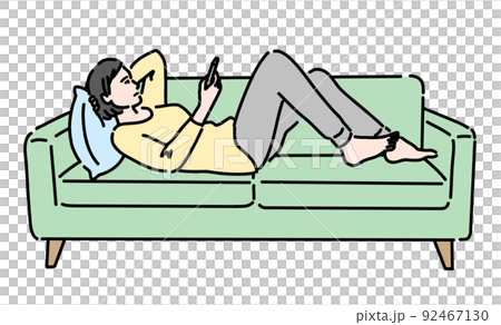 A woman lying on the sofa and looking at her smartphone A woman lying on the sofa and looking at her smartphone 92467130
