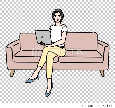 Woman sitting on the sofa and working on a laptop Woman sitting on the sofa and working on a laptop 92467131