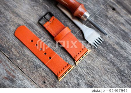 Orange leather smart watch strap hand made on wood Orange leather smart watch strap hand made on wood 92467945