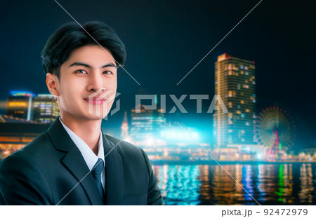 Confidence businessman portrait with Modern Japan nightlight City Background. Confidence businessman portrait with Modern Japan nightlight City Background. 92472979