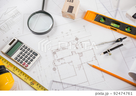 Top view of house plan blueprint paper with repair tools on table desk at architecture office 92474761