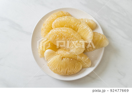 Fresh peeled pomelo, grapefruit or shaddock 92477669