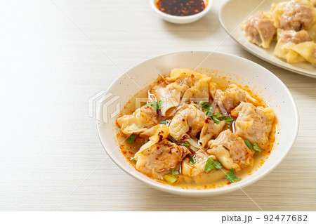 pork wonton soup or pork dumplings soup with roasted chili pork wonton soup or pork dumplings soup with roasted chili 92477682