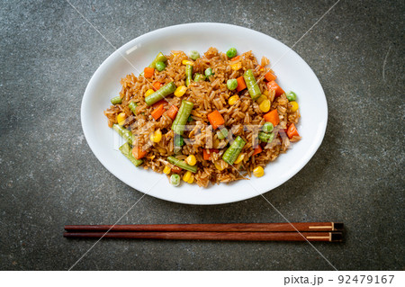 fried rice with green peas, carrot and corn 92479167