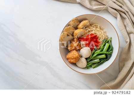 egg noodles with fish balls and shrimp balls in pink sauce, Yen Ta Four or Yen Ta Fo egg noodles with fish balls and shrimp balls in pink sauce, Yen Ta Four or Yen Ta Fo 92479182