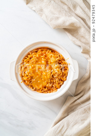 spicy instant noodle with cheese 92479345
