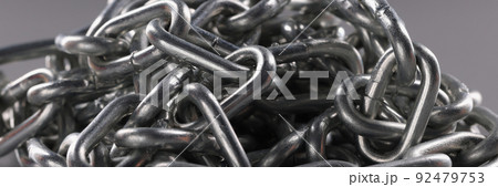 Chrome plated metal chain on gray background. Chrome plated metal chain on gray background. 92479753