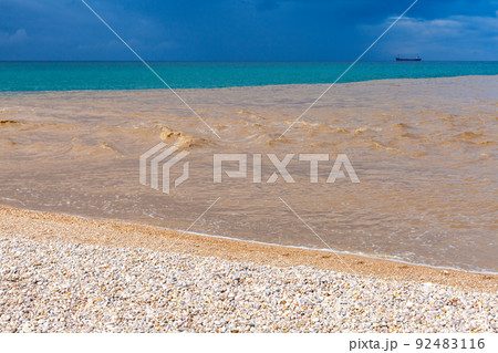 Muddy water of Belbek river mixed with blue seawater 92483116