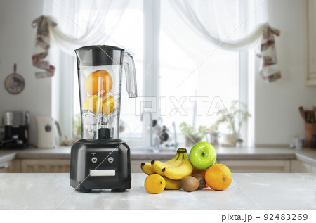 Blender and fruits on kitchen space 92483269