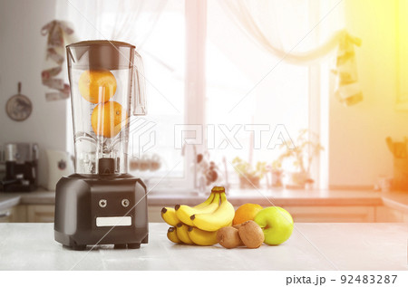 Blender, fruits and kitchen space. Sun flare 92483287