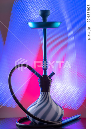 Blue eastern hookah on colorful background 92483908