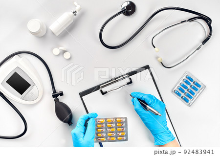 Doctor s table, tools, medical instruments, therapist tonometer, blood pressure, work in hospital on white background flat lay 92483941