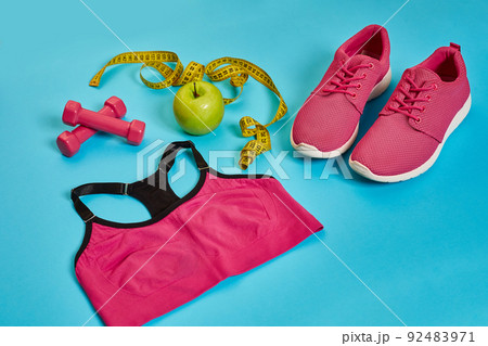 Sneakers, centimeter, green apple, weight loss, running, healthy eating, healthy lifestyle concept Sneakers, centimeter, green apple, weight loss, running, healthy eating, healthy lifestyle concept 92483971