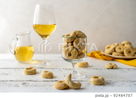 Sweet Italian cookies Taralli made with white wine, sugar, olive oil, eggs and flour Sweet Italian cookies Taralli made with white wine, sugar, olive oil, eggs and flour 92484707
