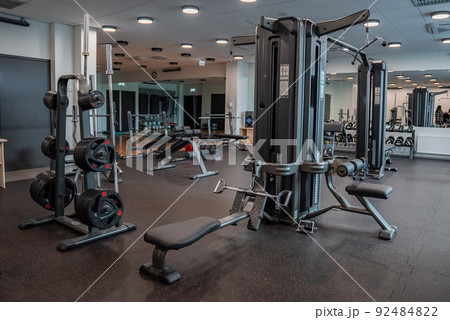 Modern light gym. Sports equipment in gym. Modern light gym. Sports equipment in gym. 92484822
