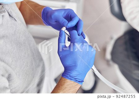 dentist is taking a drill in modern light stamotology clinic dentist is taking a drill in modern light stamotology clinic 92487255