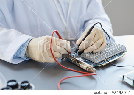 Engineer Working with Tech Parts Closeup 92492014