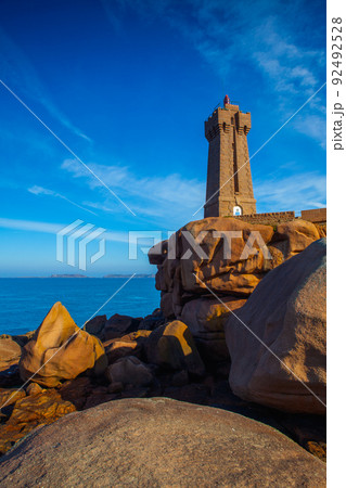 Lighthouse on the Pink Granite Coast, Ploumanach, Brittany, France Lighthouse on the Pink Granite Coast, Ploumanach, Brittany, France 92492528