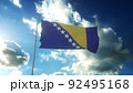 Flag of Bosnia and Herzegovina waving at wind against beautiful blue sky. 3d illustration 92495168
