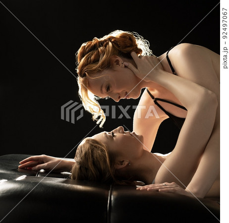 Young sensual lesbian redhead couple in sexy lingerie prepare for kiss Young sensual lesbian redhead couple in sexy lingerie prepare for kiss 92497067