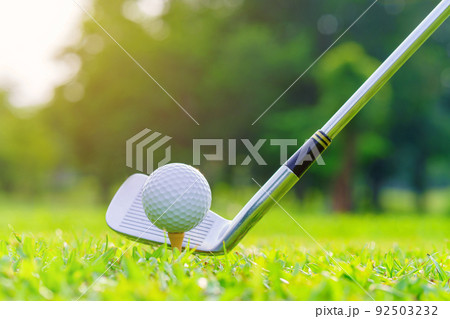Golf ball on green grass ready to be struck on golf course Golf ball on green grass ready to be struck on golf course 92503232