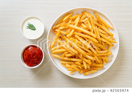 French fries with sour cream and ketchup 92503974