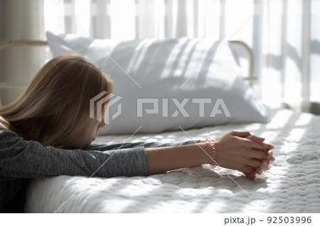 Young caucasian woman is depression and having mental problem in the bedroom at home. Young caucasian woman is depression and having mental problem in the bedroom at home. 92503996