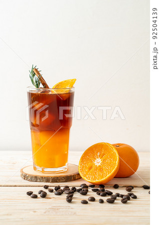 black coffee with orange and lemon juice 92504139