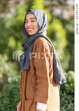 Portrait of beauty muslim woman smiling to the camera outdoors 92505104