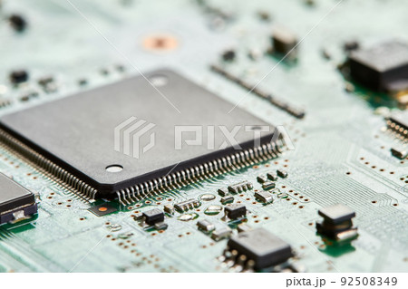 Close-up of computer chip on a part of electronic printed circuit board 92508349