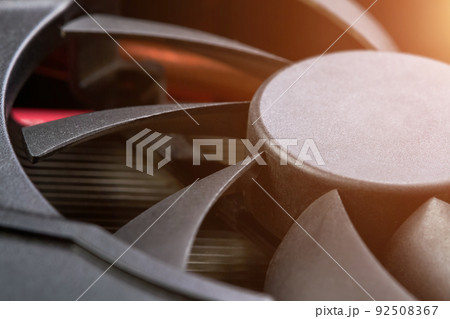 Close-up of a part of graphics card cooler with sunlight 92508367