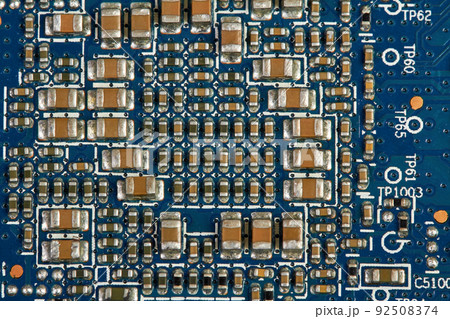 Resistors, capacitors, transistors on an electronic computer printed circuit board 92508374