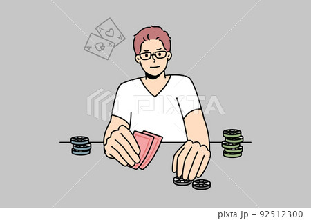 Man playing poker at table 92512300