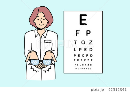 Female ophthalmologist give glasses to client  92512341
