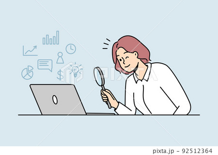 Woman looking at laptop with magnifier  92512364