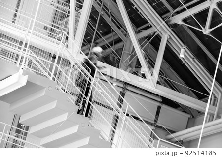 Unrecognizable person walking down steps Unrecognizable person walking down steps 92514185