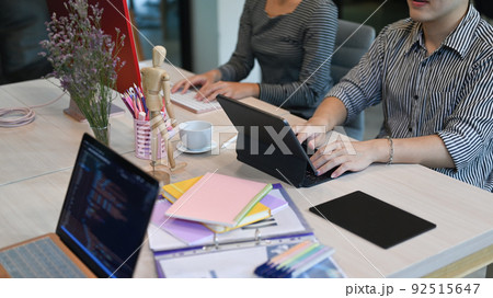 Programmers and IT software developers team working in modern office for developing programming and coding technologies Programmers and IT software developers team working in modern office for developing programming and coding technologies 92515647