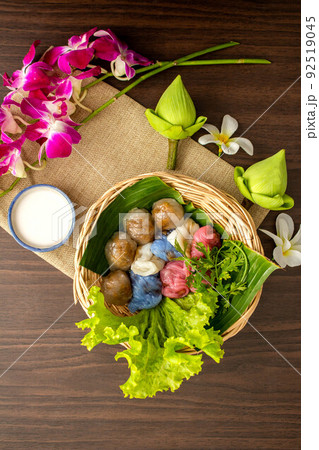 Thai dessert concept, Thai coconut milk custard and tapioca balls with pork filling on basket Thai dessert concept, Thai coconut milk custard and tapioca balls with pork filling on basket 92519045