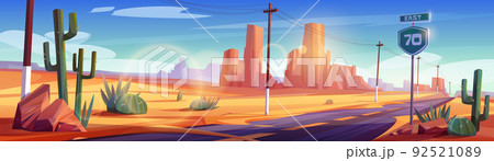 Road in desert landscape with rocks and cacti 92521089