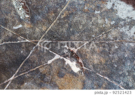 Texture detail macro of burned and scratched hard drive disk 92521423