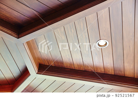 Well finished fancy looking wooden ceiling with geometric lines and design 92521567