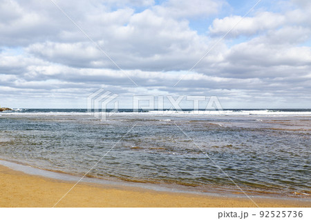 Views of a beach and a coastal city in the background. Concept travel Views of a beach and a coastal city in the background. Concept travel 92525736