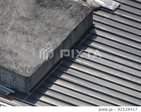 SELANGOR, MALAYSIA -JUNE 16, 2021: Construction workers install trusses and roofing sheets at construction sites. Lightweight roof trusses used are more economical, sturdy and fast. SELANGOR, MALAYSIA -JUNE 16, 2021: Construction workers install trusses and roofing sheets at construction sites. Lightweight roof trusses used are more economical, sturdy and fast. 92526417