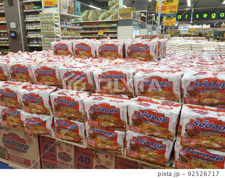 SELANGOR, MALAYSIA -MAY 2, 2020: Various brands of instant noodles in a commercial packages stacked for sale on the display shelves in supermarkets. Tagged with price tag. SELANGOR, MALAYSIA -MAY 2, 2020: Various brands of instant noodles in a commercial packages stacked for sale on the display shelves in supermarkets. Tagged with price tag. 92526717
