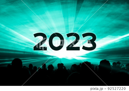 Happy new year 2023 turquoise laser show party people crowd. Luxury entertainment with audience silhouettes turn of the year celebration. Premium nightlife event at holidays season party time. 92527220