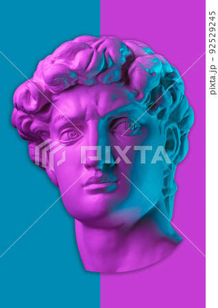 Gypsum copy of head statue David in bright neon colors for artists on a color background. Face famous sculpture youth of David by Michelangelo. Template design for dj, fashion, poster, zine, collage. Gypsum copy of head statue David in bright neon colors for artists on a color background. Face famous sculpture youth of David by Michelangelo. Template design for dj, fashion, poster, zine, collage. 92529245