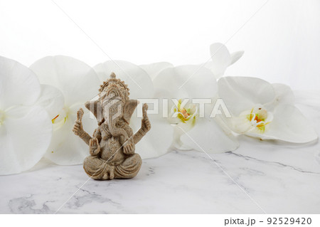 Happy Ganesh Chaturthi festival, Lord Ganesha statue with beautiful orchid flowers on white background, Happy Ganesh Chaturthi festival, Lord Ganesha statue with beautiful orchid flowers on white background, 92529420